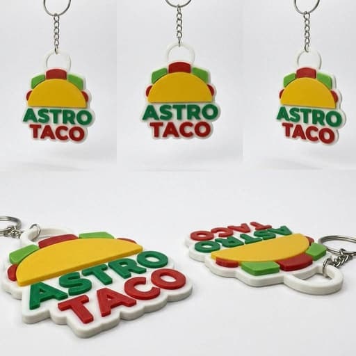Llaveros ASTRO TACO impresos en rojo, verde, amarillo y blanco